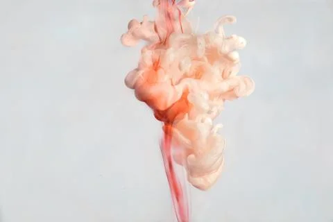 A Cloud Of Pink Paint In Water Stock Photos