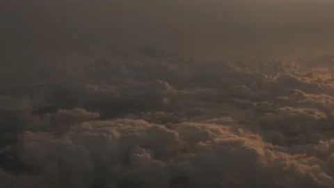 Cloud from plane window during sunset 4K Stock Footage 220561487