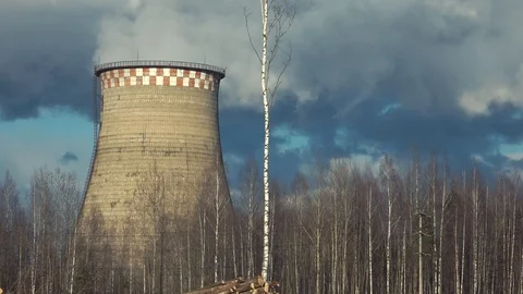 Cloud production. Cooling tower of thermal power station. Steam rises from the Stock Footage 128461746