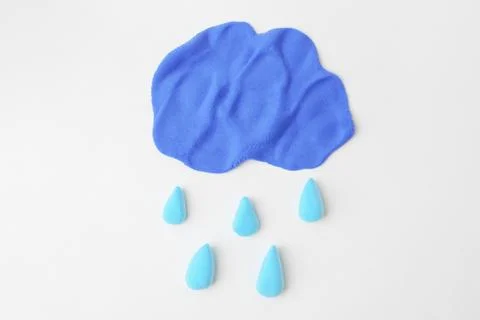 Cloud with rain drops made from play dough on light grey background, top view Stock Photos