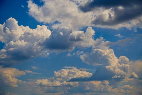 Cloud range in blue sky, close-up, cloud formation in sky, cyclone formation Stock Photos