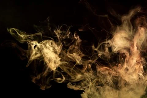 Cloud of red and orange smoke on a black isolated background. Background from Foto stock