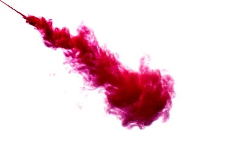 A cloud of red paint is released into the clear water. Isolate on a white bac Stock Photos
