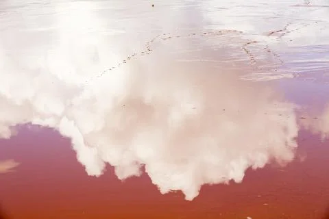 Cloud reflected in contaminated mine effluent from water draining out of whea Stock Photos
