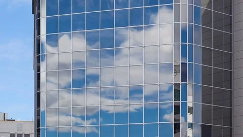 Cloud reflection 4K timelapse close up on skyscraper mirror glass Stock Footage 78661950