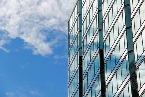Cloud reflection in office building windows. Stock Photos