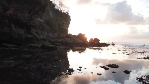 Cloud Reflection in Still Water on Shore with Sunset [Drone Footage] Stock Footage 96249383