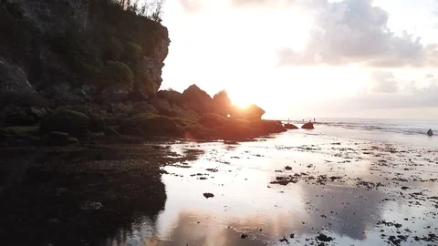 Cloud Reflection in Still Water on Shore with Sunset [Drone Footage] Stock Footage 96249461