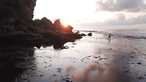 Cloud Reflection in Still Water on Shore with Sunset [Drone Footage] Stock Footage 96250361