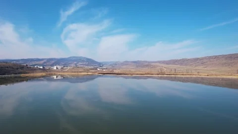Cloud reflections in the lake aerial Stock Footage 241486247