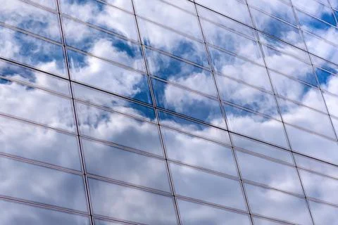 Cloud reflections on modern glass facade pattern Stock Photos