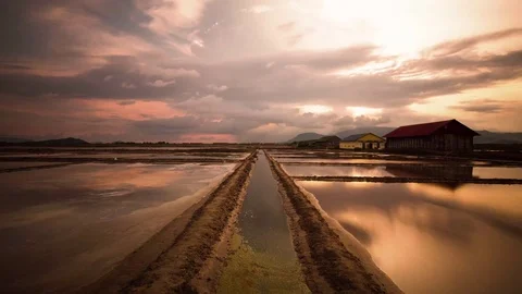 Cloud reflections on the salt fields of Asia.  Mirror image time lapse Stock Footage 79314923