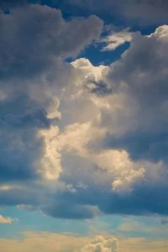 Cloud ridge in the blue sky close-up, cloud cluster in the sky, cyclone forma Stock Photos
