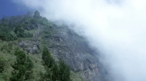 Cloud rising over the mountain Stock Footage 47315730