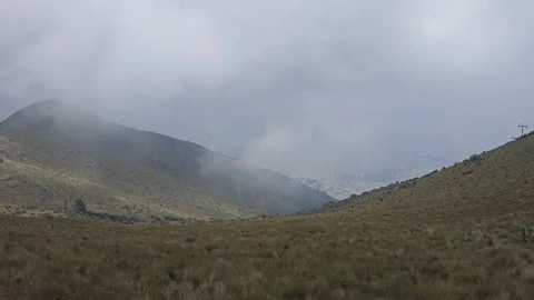 Cloud Rolling over Grassy Slope into Valley, Cruz Loma, Quito, Ecuador 8K Stock-Footage 331494416