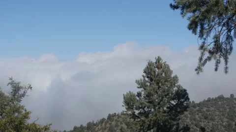 Cloud rolling over a mountain 스톡 동영상 142096808