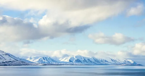 Cloud rolling time lapse over snow mountain fjords in Akureyri, Iceland. Stock Footage 136773924