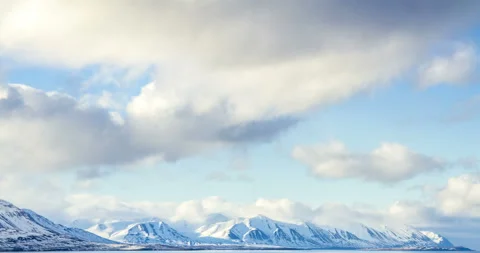 Cloud rolling time lapse over snow mountain fjords in Akureyri, Iceland. Stock Footage 136773966