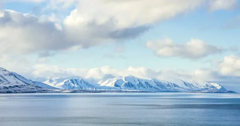 Cloud rolling time lapse over snow mountain fjords in Akureyri, Iceland. Stock Footage 136774001