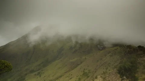 Cloud rolls down foothills of Mount Merapi, Indonesia Stock Footage 45349633