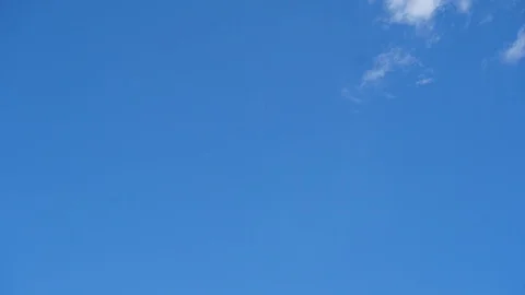 Cloud running across the sky. Timelapse of white clouds, blue sky in background Stock Footage 95641364
