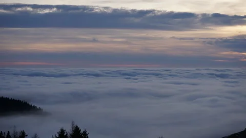 Cloud sea time-lapse at sunset from a mountain top shot at 50mm [1] Stock Footage 229772519