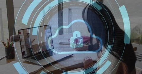 Cloud security image over person working on laptop at home Foto stock