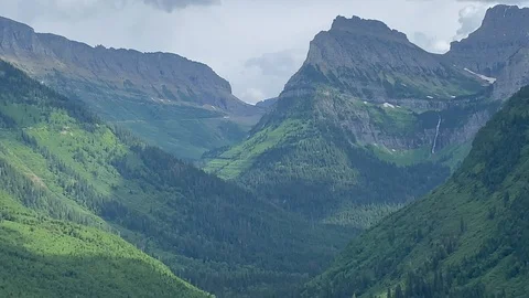 Cloud shadow creeping through green mountain valley Stock Footage 114749494