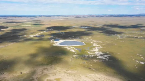Cloud shadow moving on meadow and lake surface, Inner Mongolia, China. Vídeo Stock 97609397