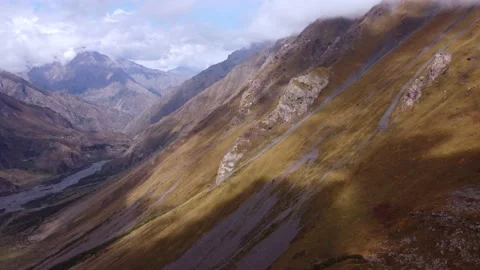 Cloud shadows on the autumn mountain slope Stock Footage 168569535