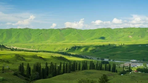 Cloud shadows flowing over the Qiaxi grassland in Xinjiang. Stock Footage 282154162