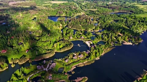 Cloud shadows moving across summer landscape with a lake system and vacation 库存影片 336778606
