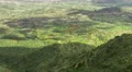 Cloud shadows moving on green pasture. Fantastic aerial view of beautiful nature 4k or 4k+ Resolution