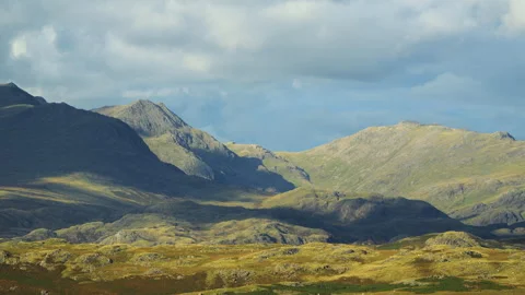 Cloud shadows racing over mountainous and rugged landscape. Time lapse. Stock Footage 285022083