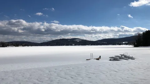 Cloud Shadows in Winter over Frozen Lake Stock Footage