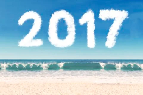Cloud shaped number 2017 on the beach 스톡 일러스트
