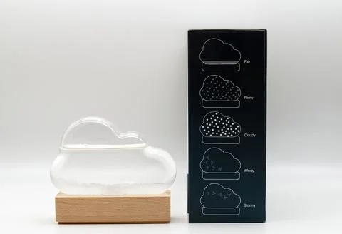 Cloud shaped weather forecasting storm glass with crystal formations. Stock Photos