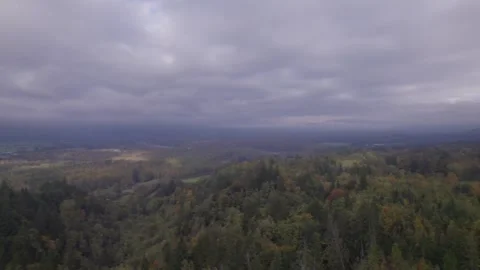Cloud shrouded mountain with valley b elow Stock Footage 253830909
