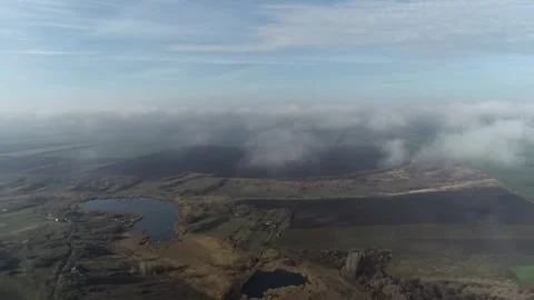 Cloud-skipping flight: Drone through skies, clouds and landscapes Stock Footage 311129431