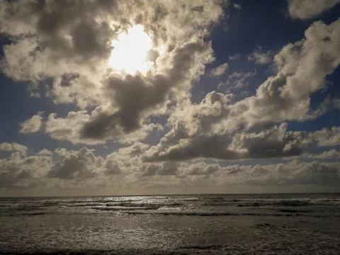 Cloud sky on the beach and beautiful tropical sea. Stock Photos
