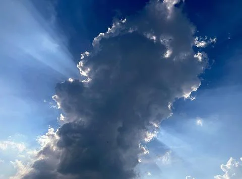 A cloud in the sky, with a person on it Fotos Stock