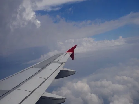 Cloud Sky with Plane Wing Stock Footage 76099398