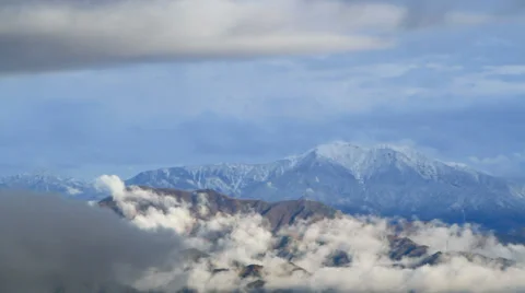 Cloud slides over the mountain range. Stock Footage 32807467