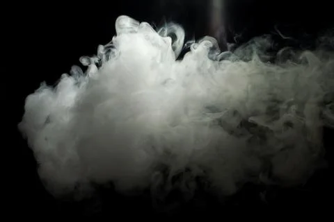 Cloud of smoke on a black background Stock Photos