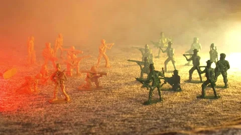 A cloud of smoke envelops the imaginary battlefield of toy plastic soldiers Stock Footage 172571849