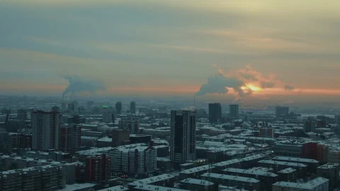 Cloud-like steam exits thermal power plant against backdrop of a twilight city. Stock Footage 113728052