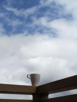 A cloud of steam over a tea Cup. Stock Photos