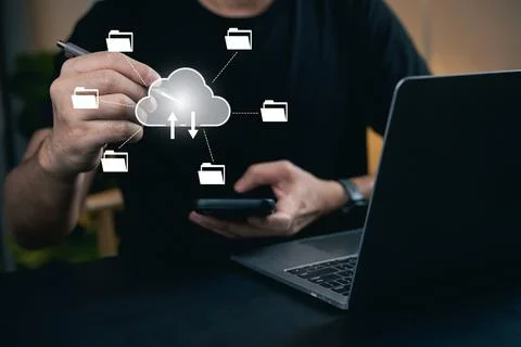 Cloud Storage Concept with Person Interacting with Smartphone and Laptop, F.. Stock Photos