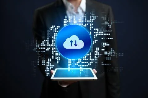 Cloud storage technology is shown on a tablet in a business setting Stock Photos