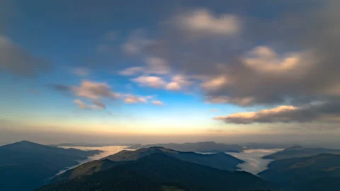 The cloud stream above beautiful mountains. time lapse Stock Footage 95210339